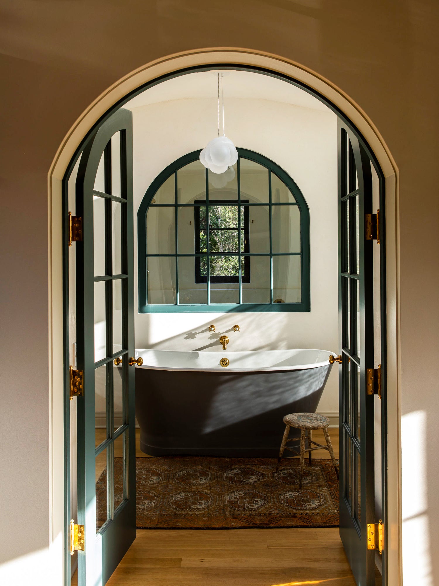 Arched doorway with soaking tub