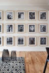 black and white family photo gallery wall