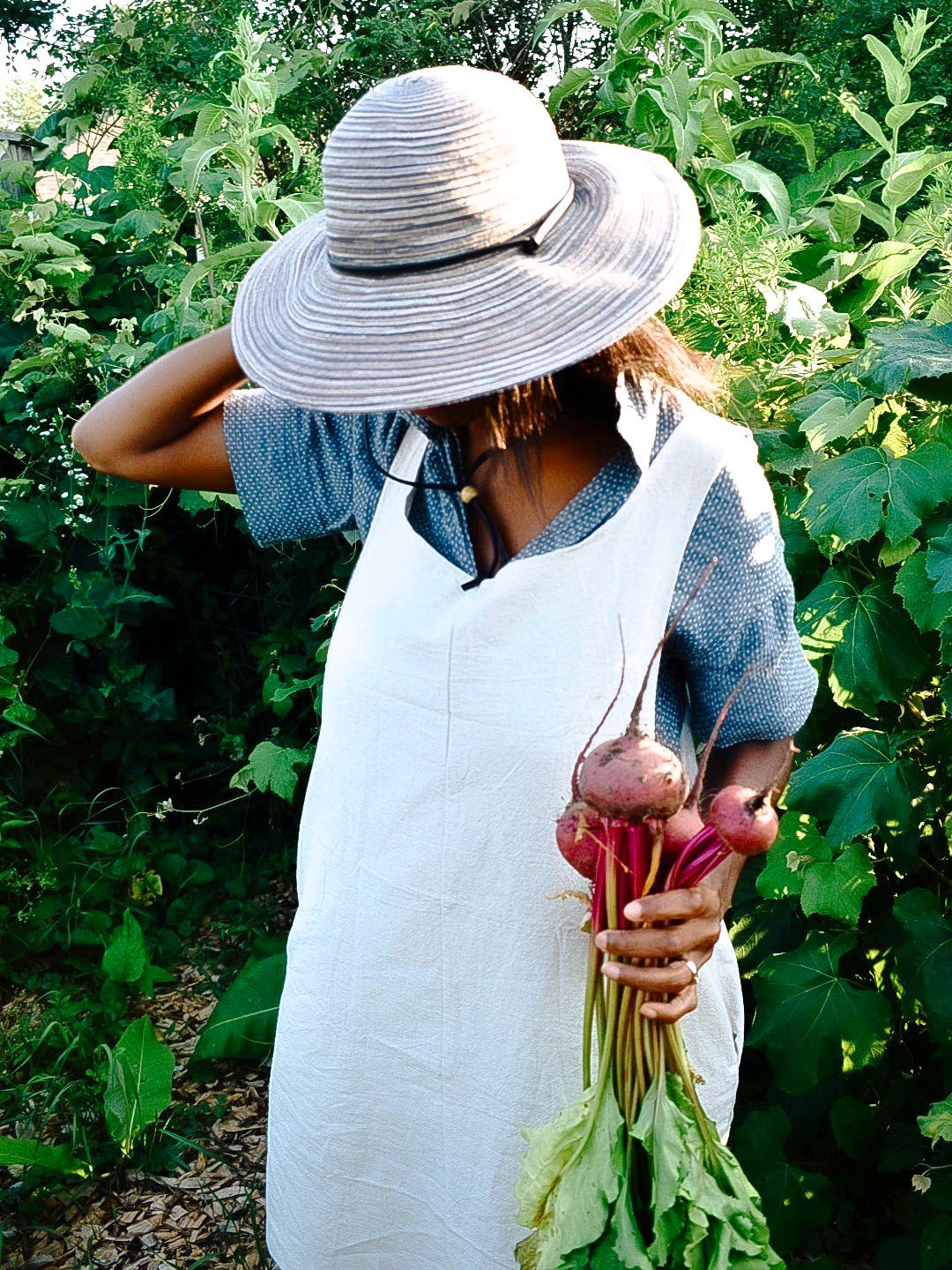 Woman holding freshly picked radishes