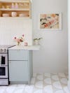 bright white kitchen with sculptural floor tile pattern