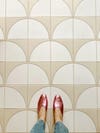 pink shoes against floor tiles