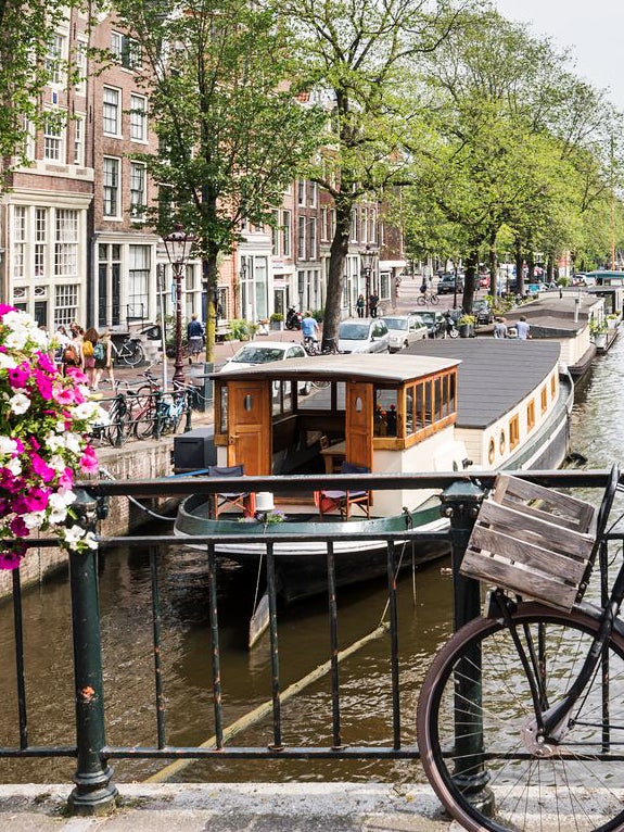 amsterdam river with a house boat