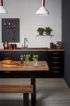 black kitchen with wooden counters
