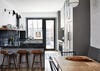 Gray kitchen with wood counter stools