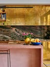 brass kitchen cabinets pink concrete island