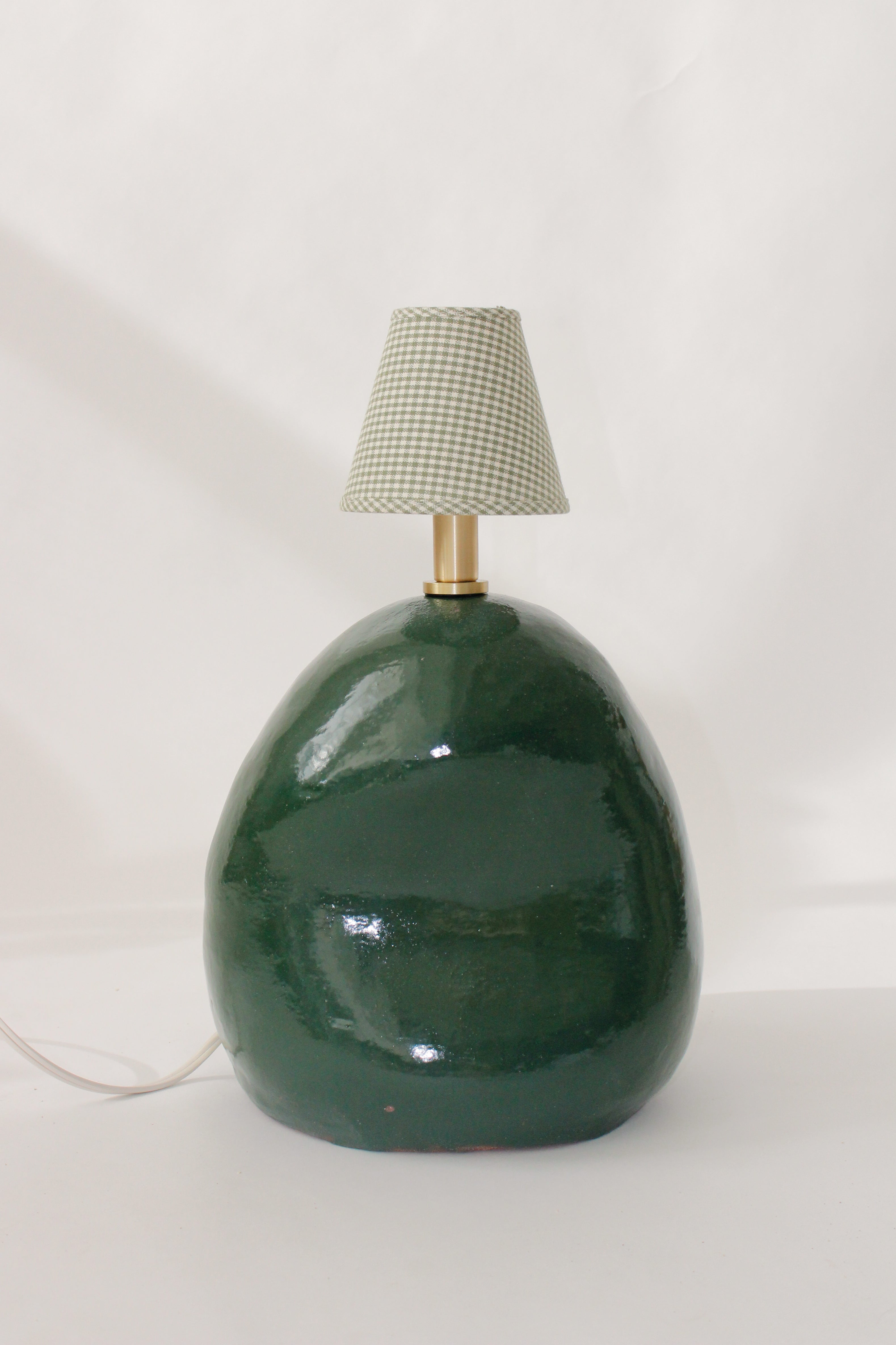 green lamp with checkered shade