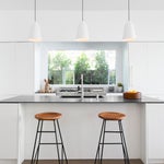 White kitchen with wooden bar stools