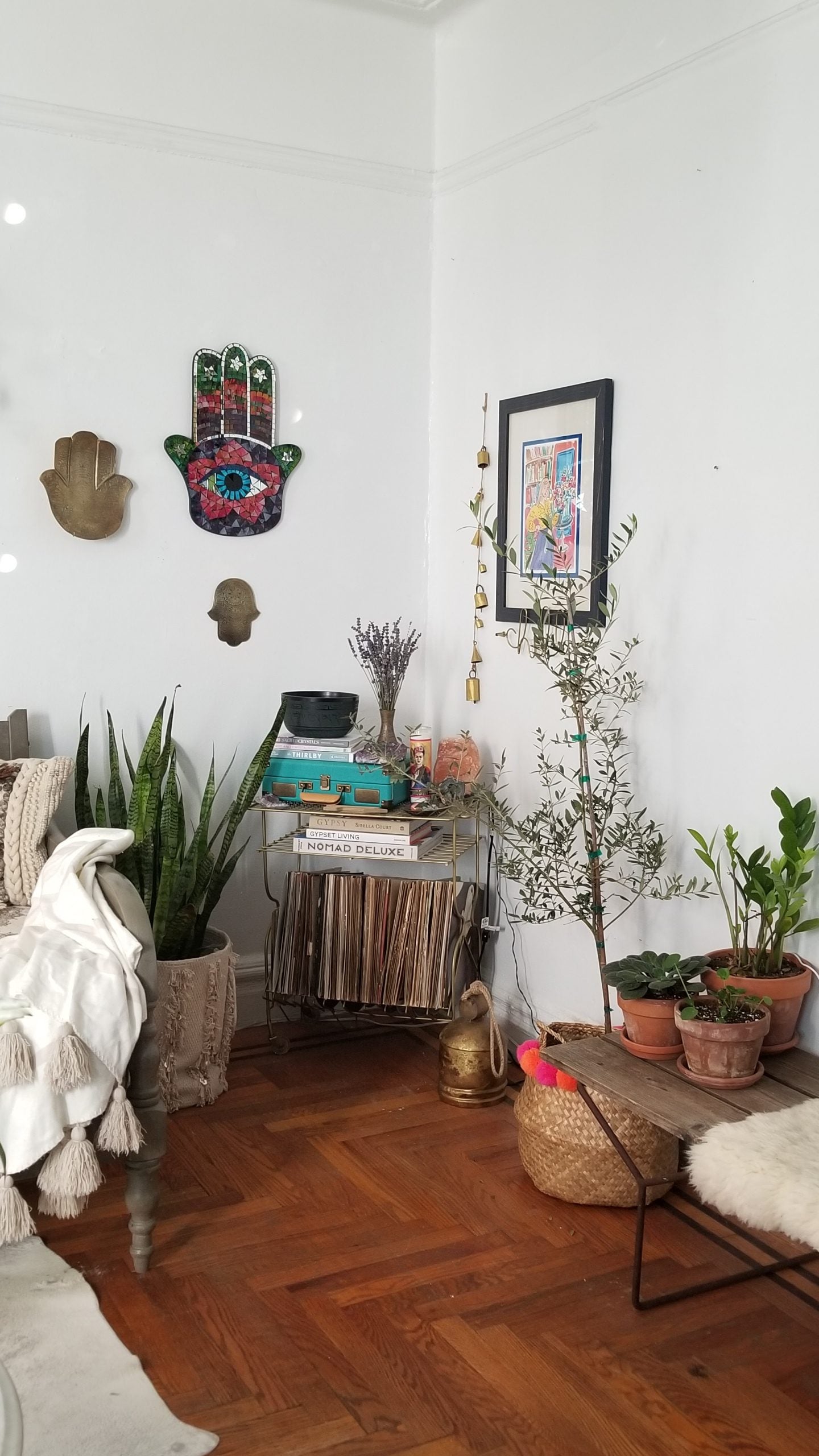 Record player and records with plants nearby
