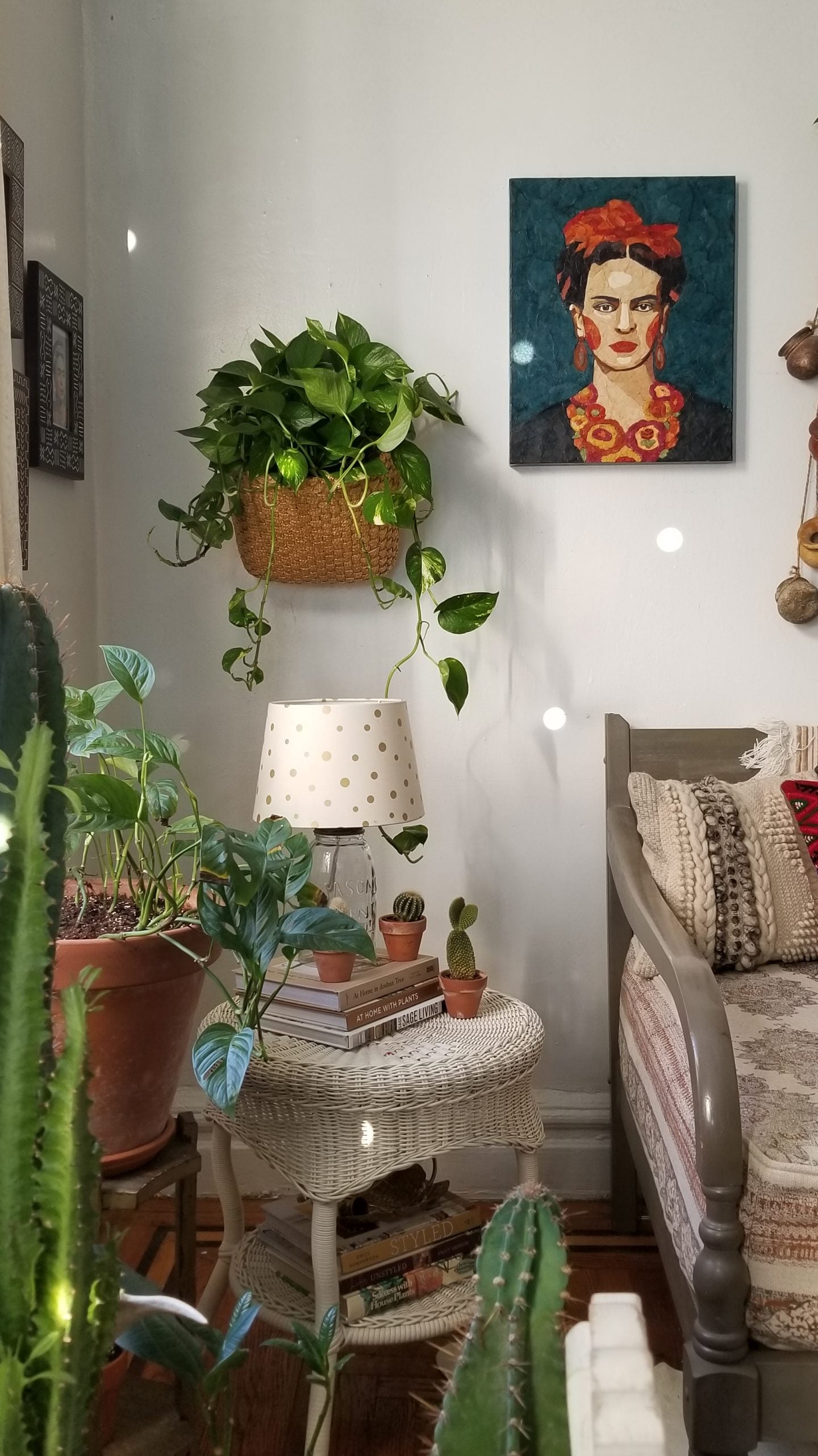 Corner with lamp, art, and plants