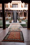 vintage rugs leading to a fountain