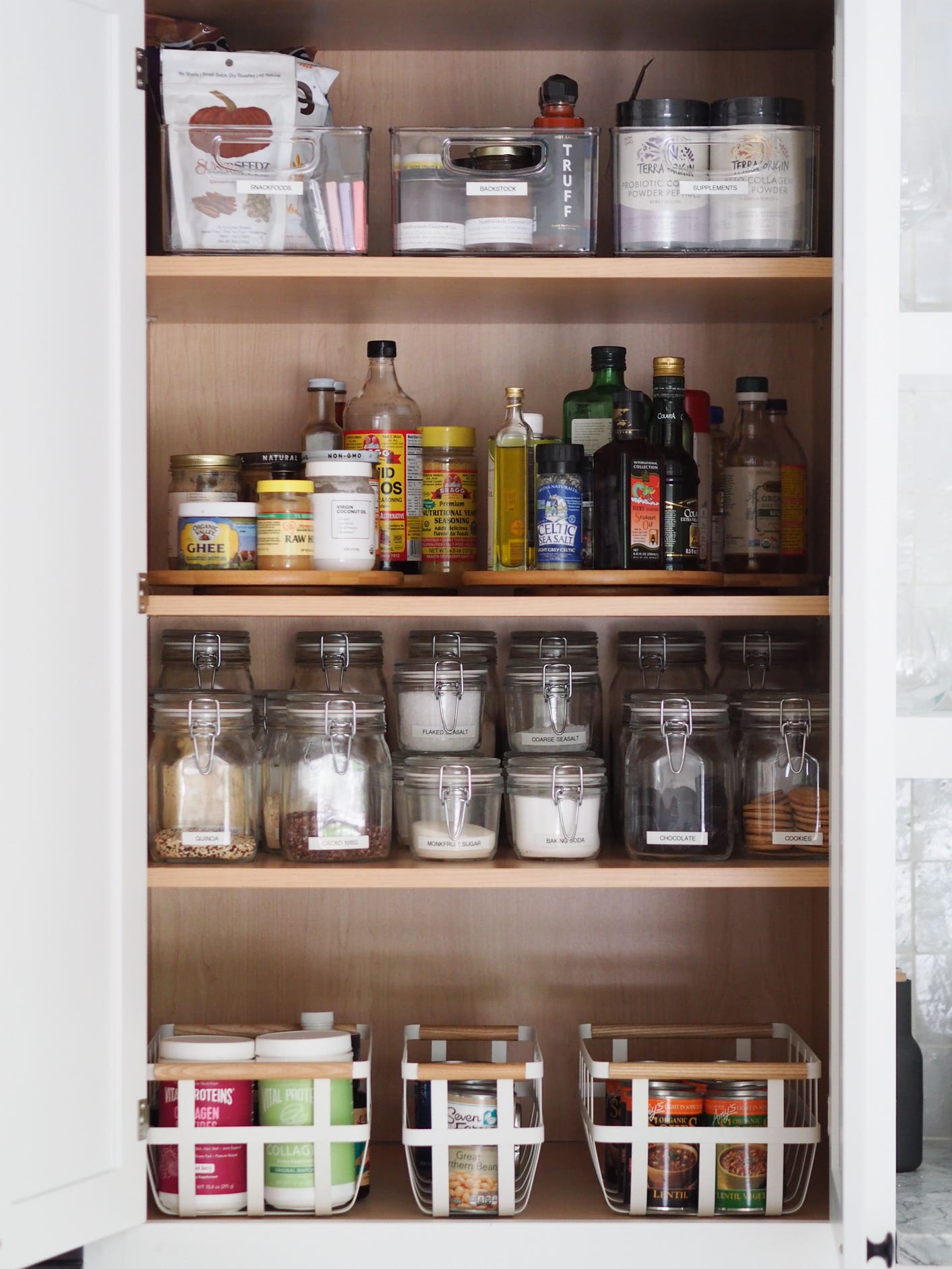after photo of a tidy pantry cabinet with shelves