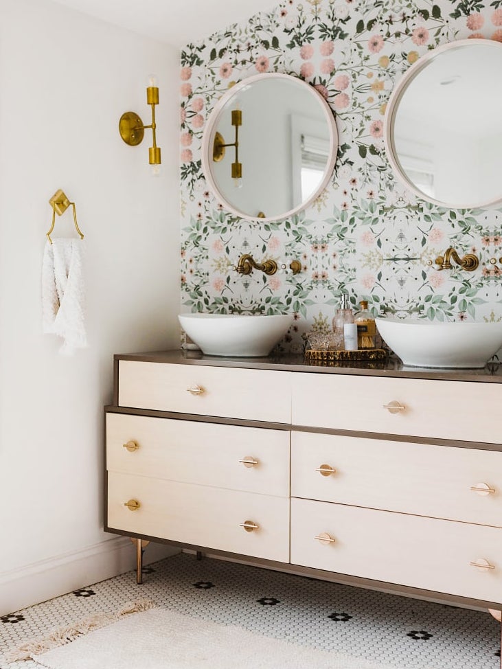 floral wallpaper with a large dresser-turned-vanity