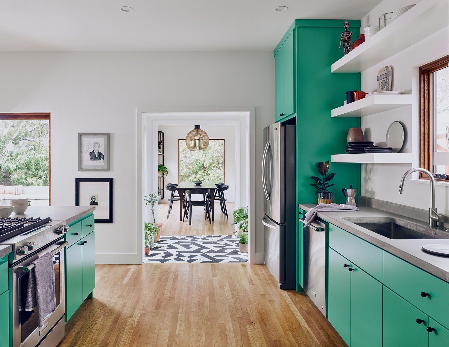 Green kitchen with wood floors