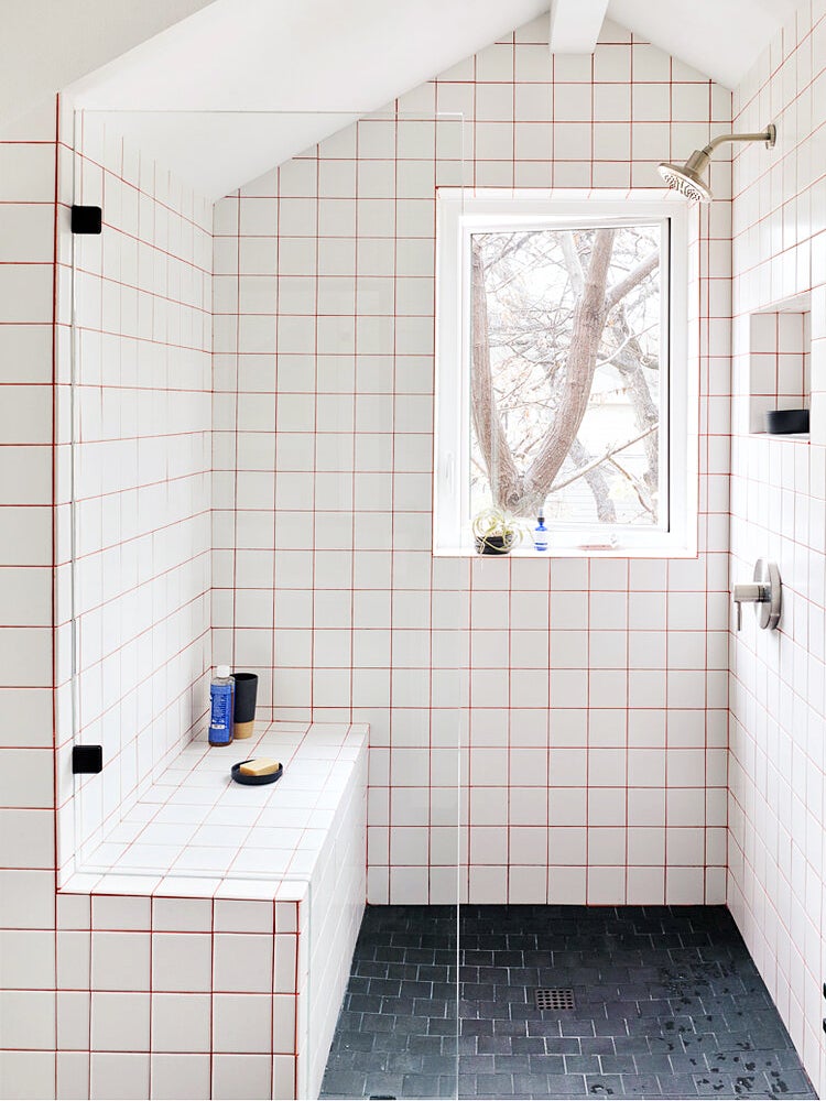 Shower with white tile and red grout