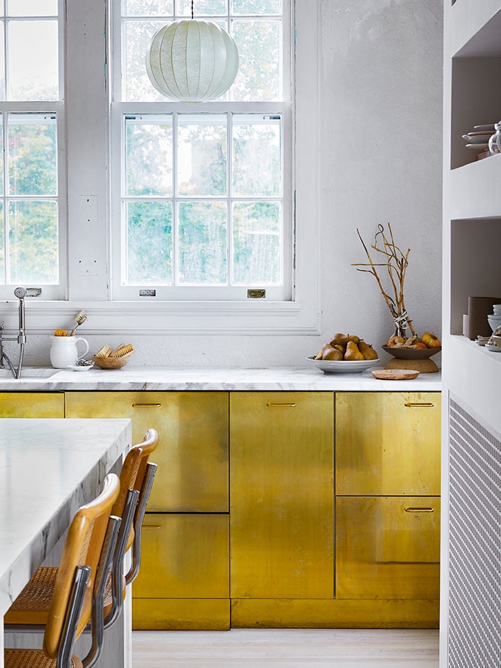 Brass Cabinets and a Few Lucky Surprises Made This Century-Old Home Truly Shine
