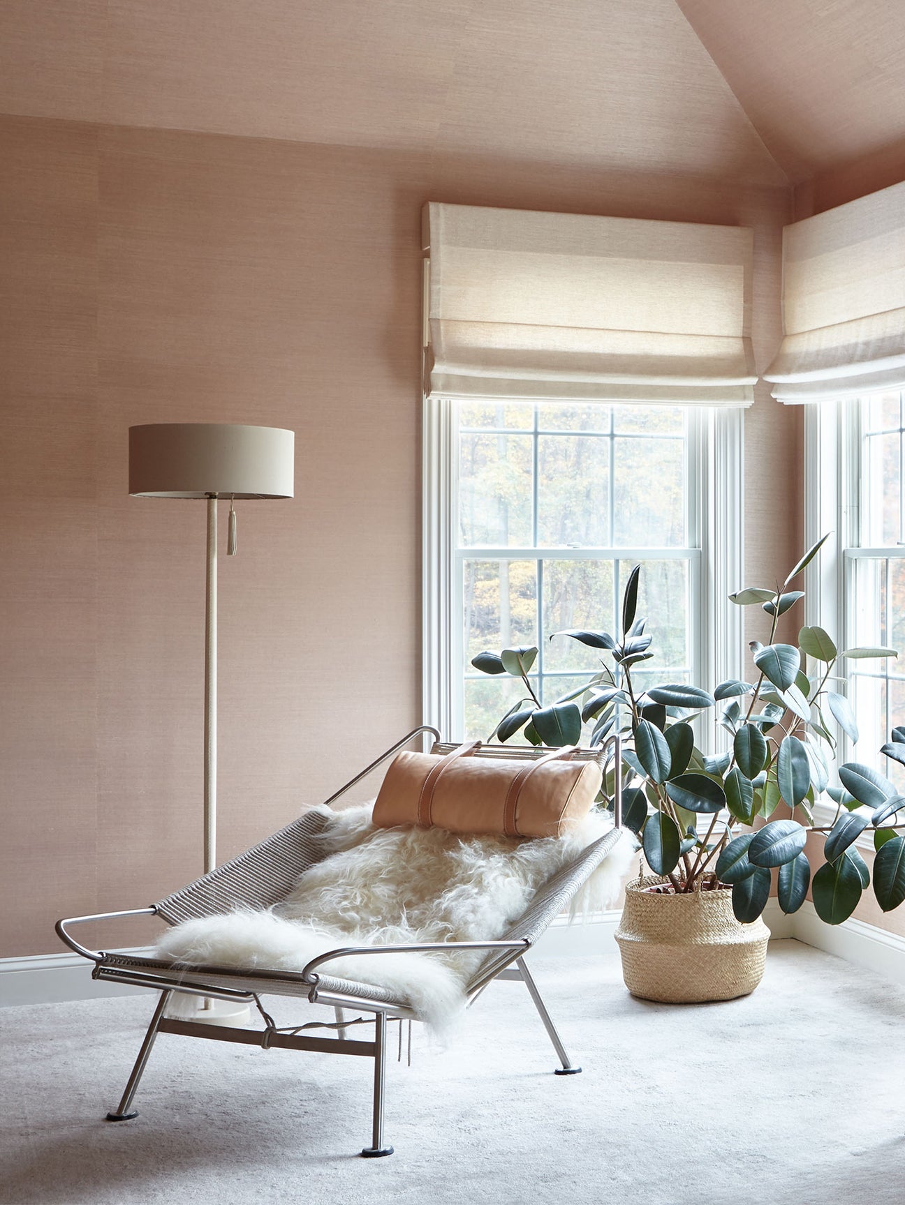 Blush Bedroom corner with chair and plant
