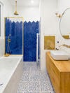 shower with blue tile pattern