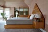 Blush bedroom with triangle headboard