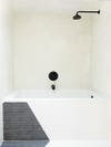 black and white bathroom with tub