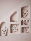 wall niches filled with pink jewelry