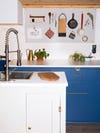 kitchen sink and blue cabinets