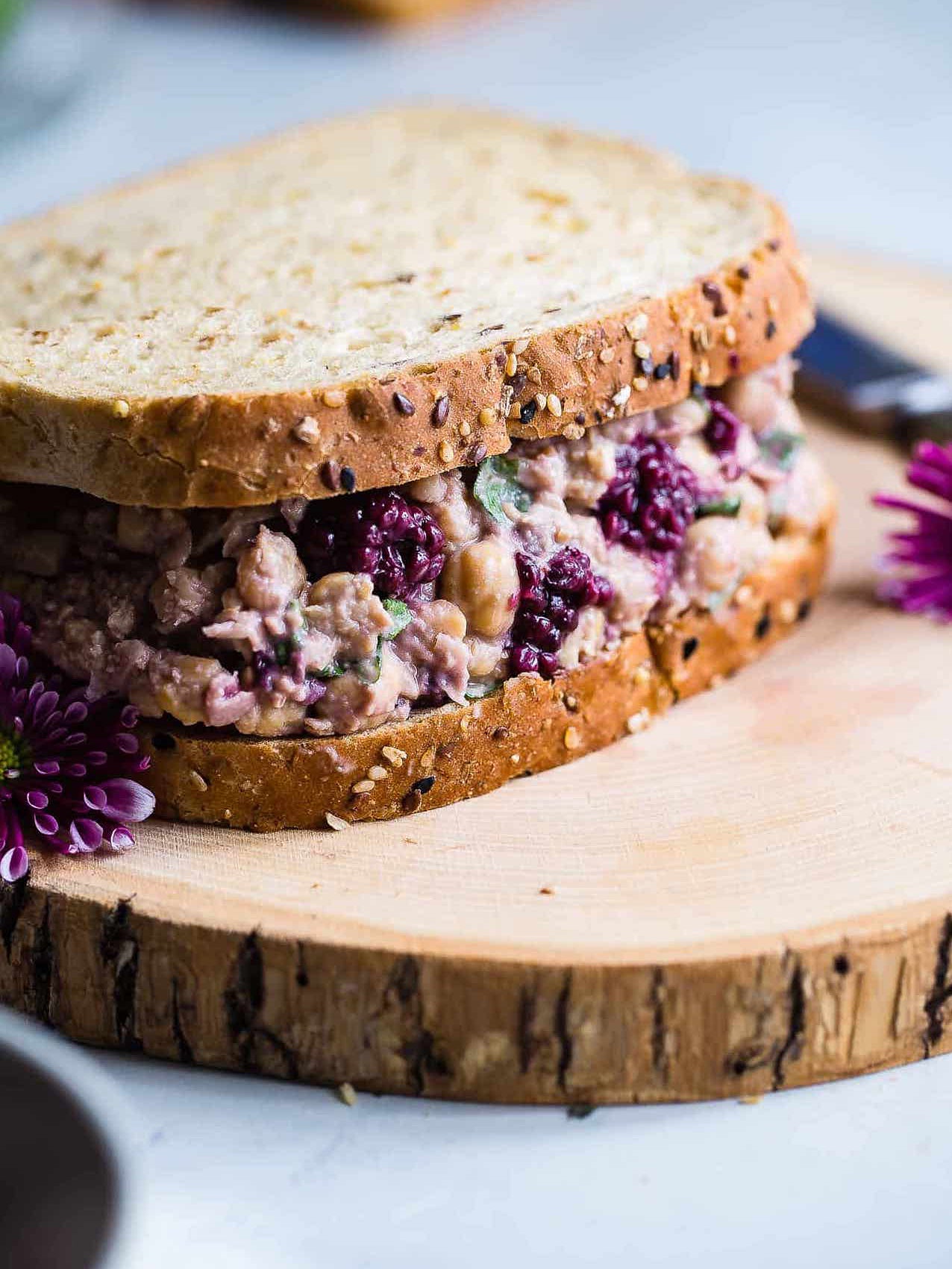 wheat brad with purple chickpea salad in between slices