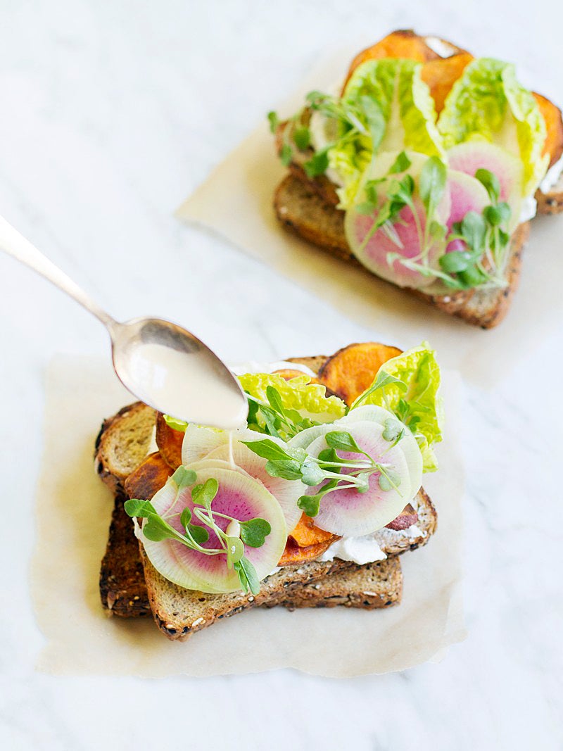 open face sandwich wiht radishes and goat cheese and orange potaotes