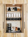 wooden coffee nook with neutral colored mugs