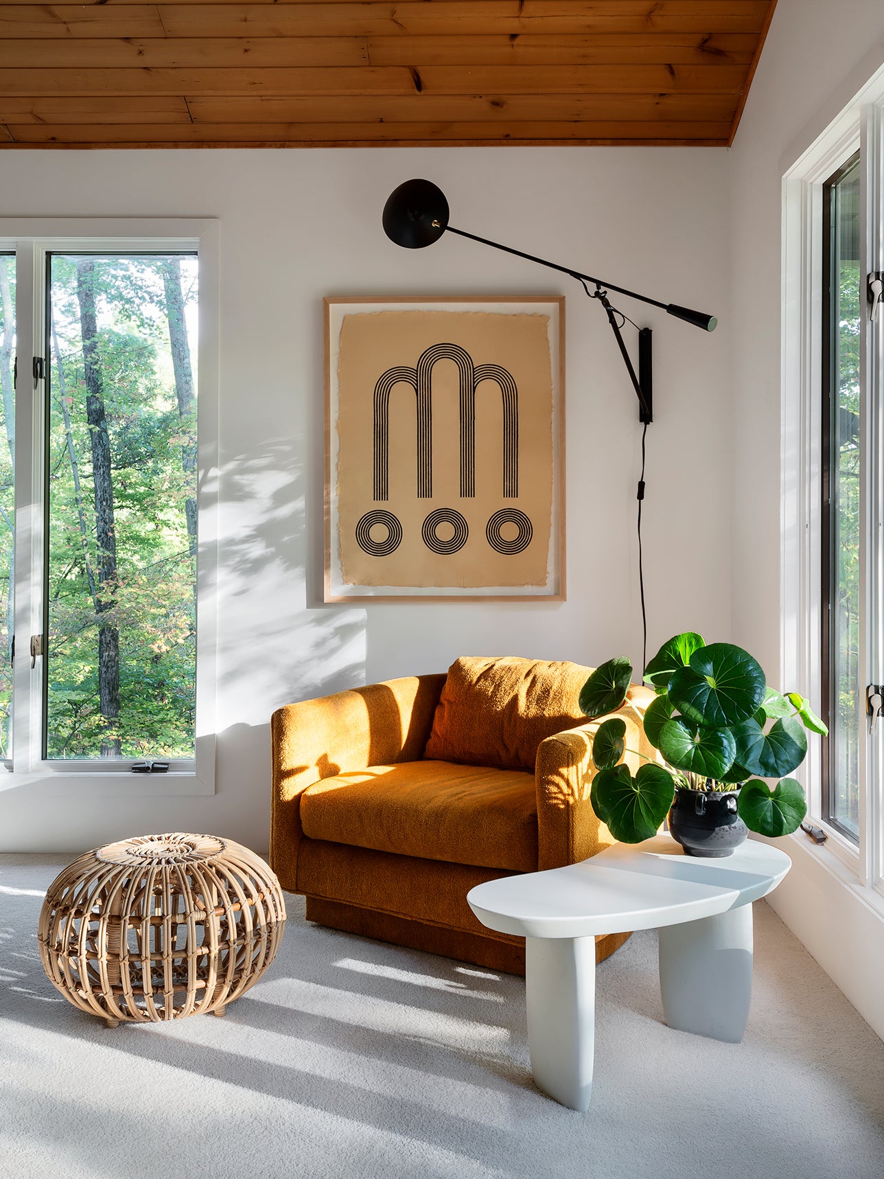sunny nook with a window and an orange chair