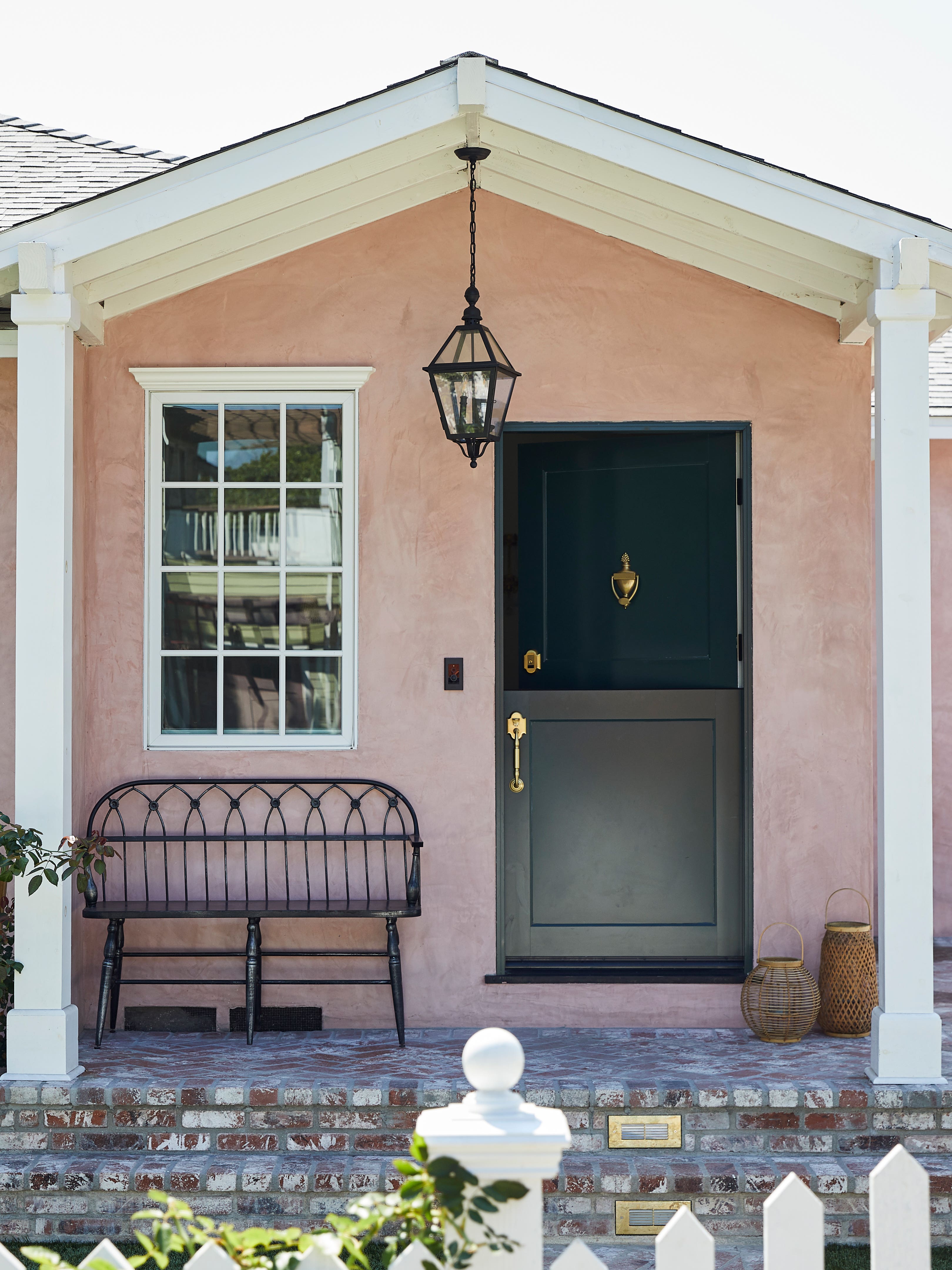 tiny pink cottage with green dutch door