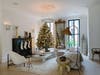 white modern living room wiht a christmast tree