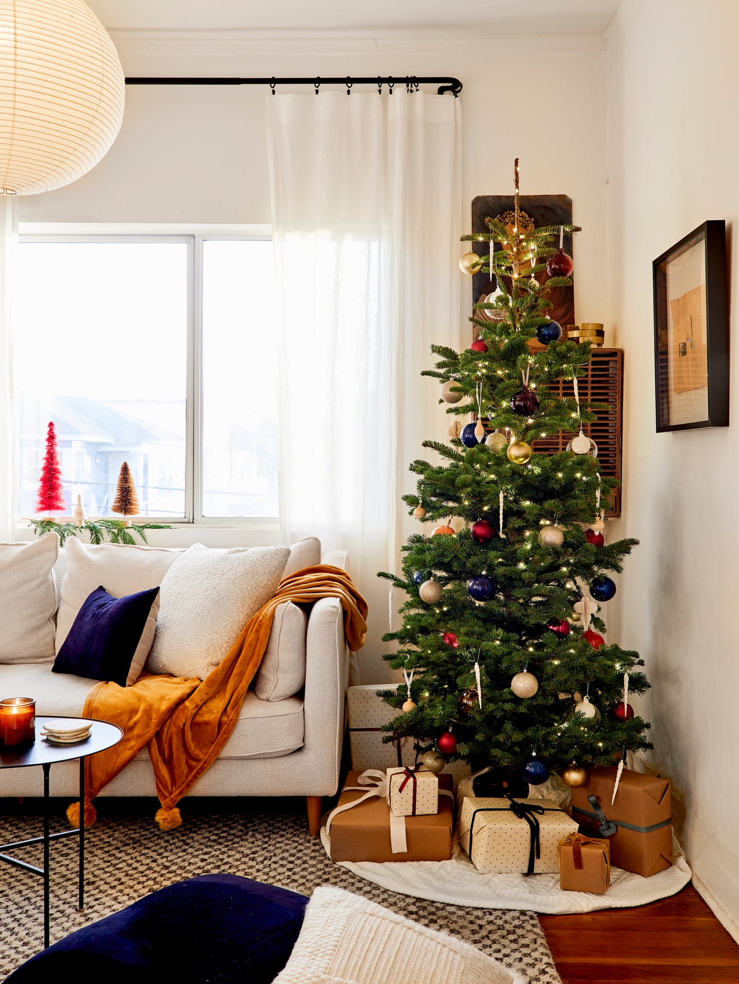 christmas tree in living room with presents underneath