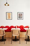 seating area with red pillows