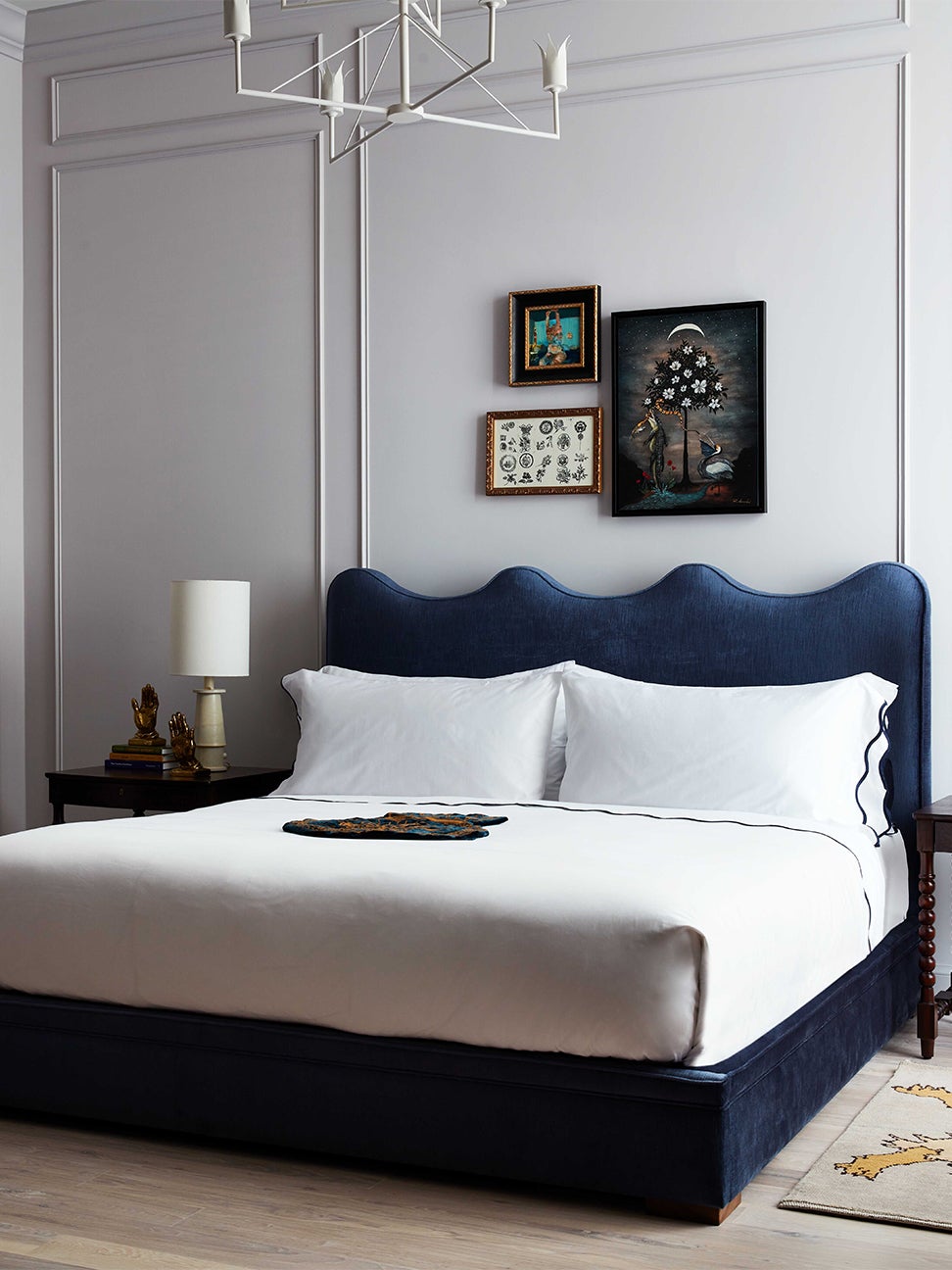hotel bed with blue headboard