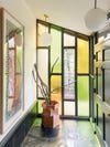 yellow and green stained glass entryway wall