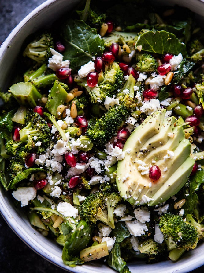 kale salad with avocado and pomegranate seeds