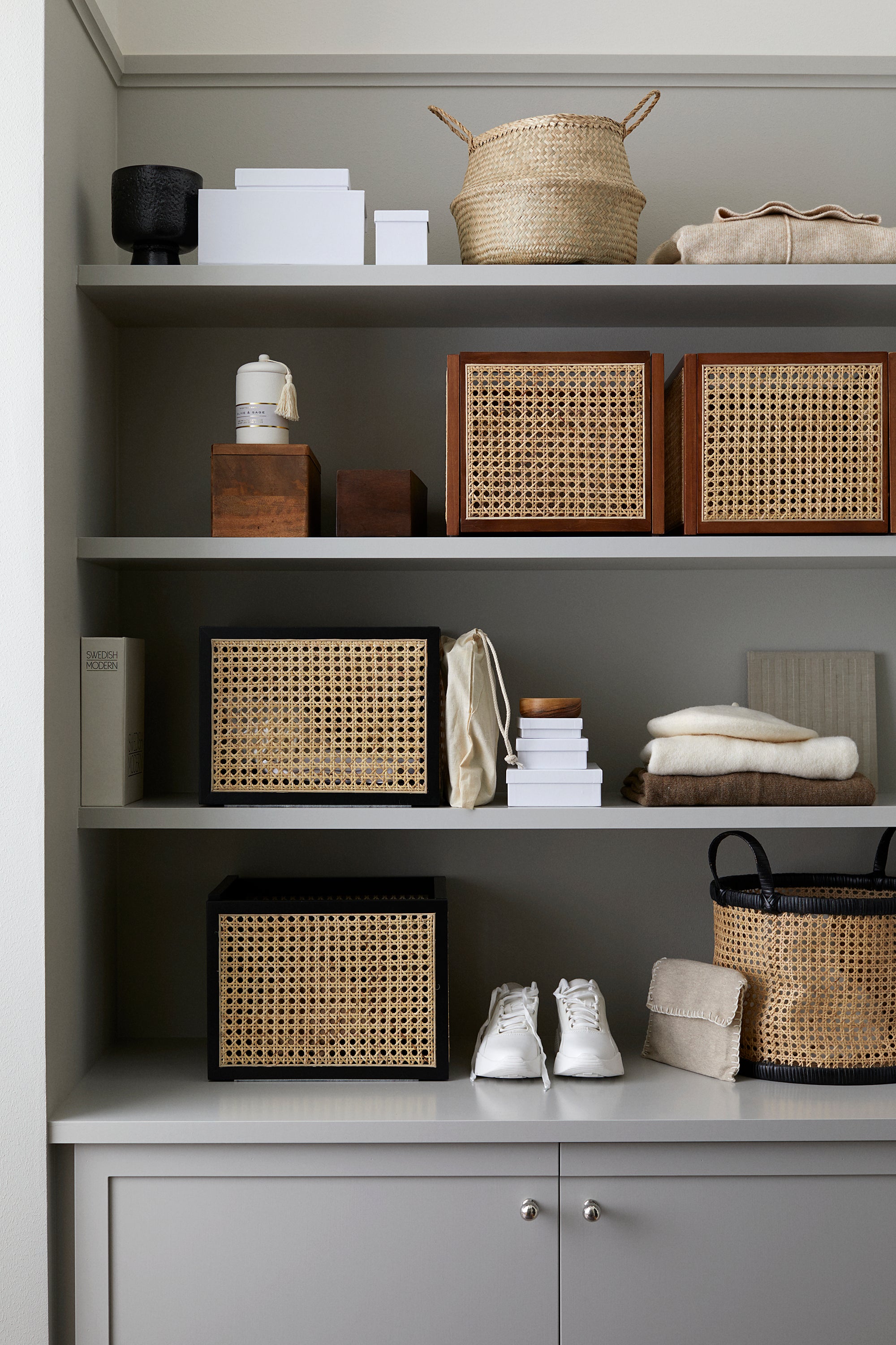 shelves with cane storage baskets