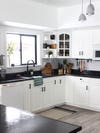 white kitchen cabinets with glass panel section