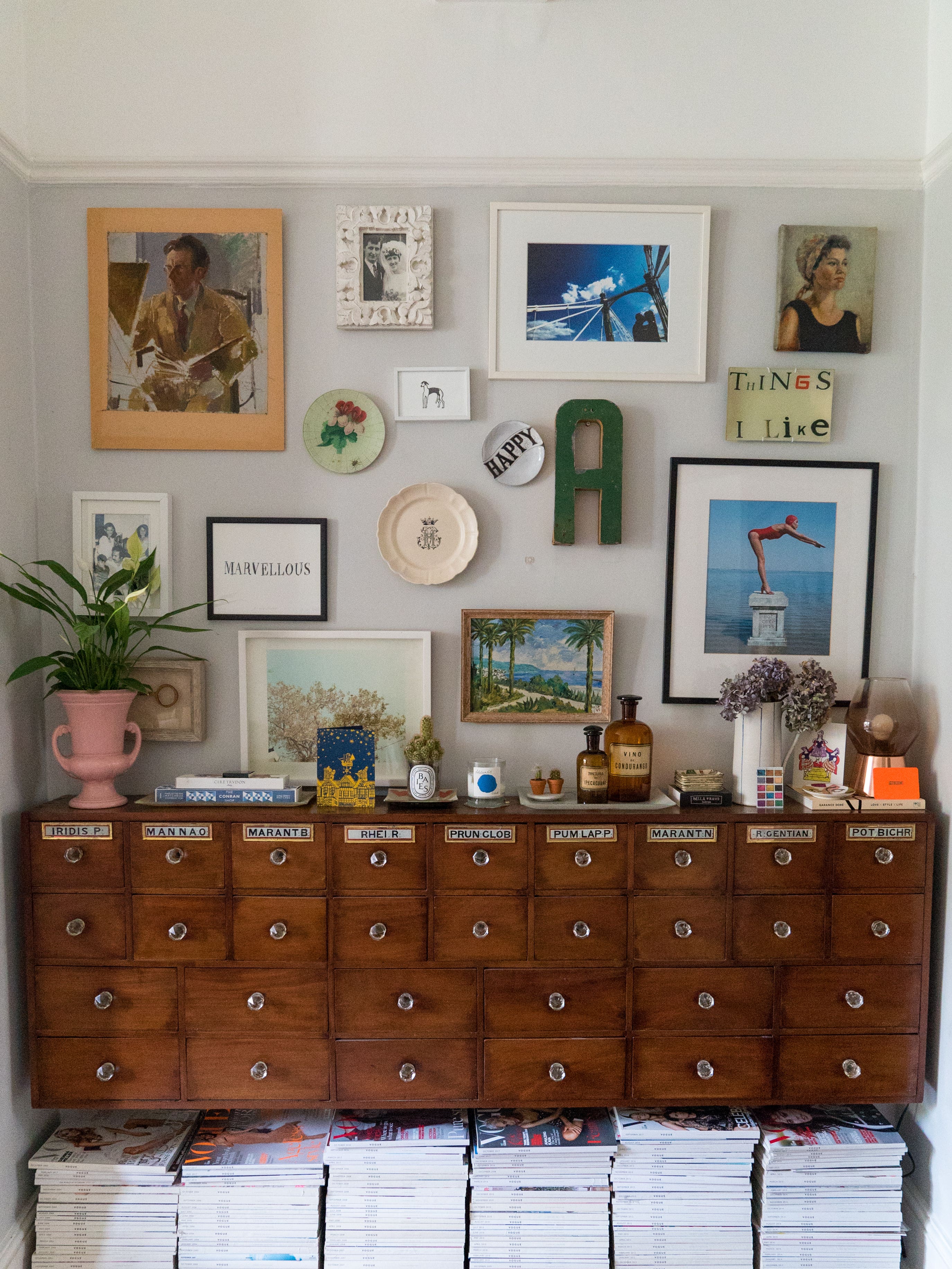 Antique cabinet with gallery wall