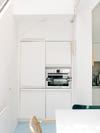 tiny white kitchen cabinets