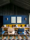 blue and black restaurant with golden sofa