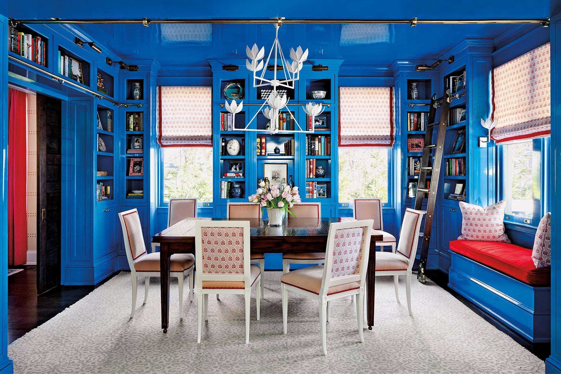 Cobalt blue dining room with red accents
