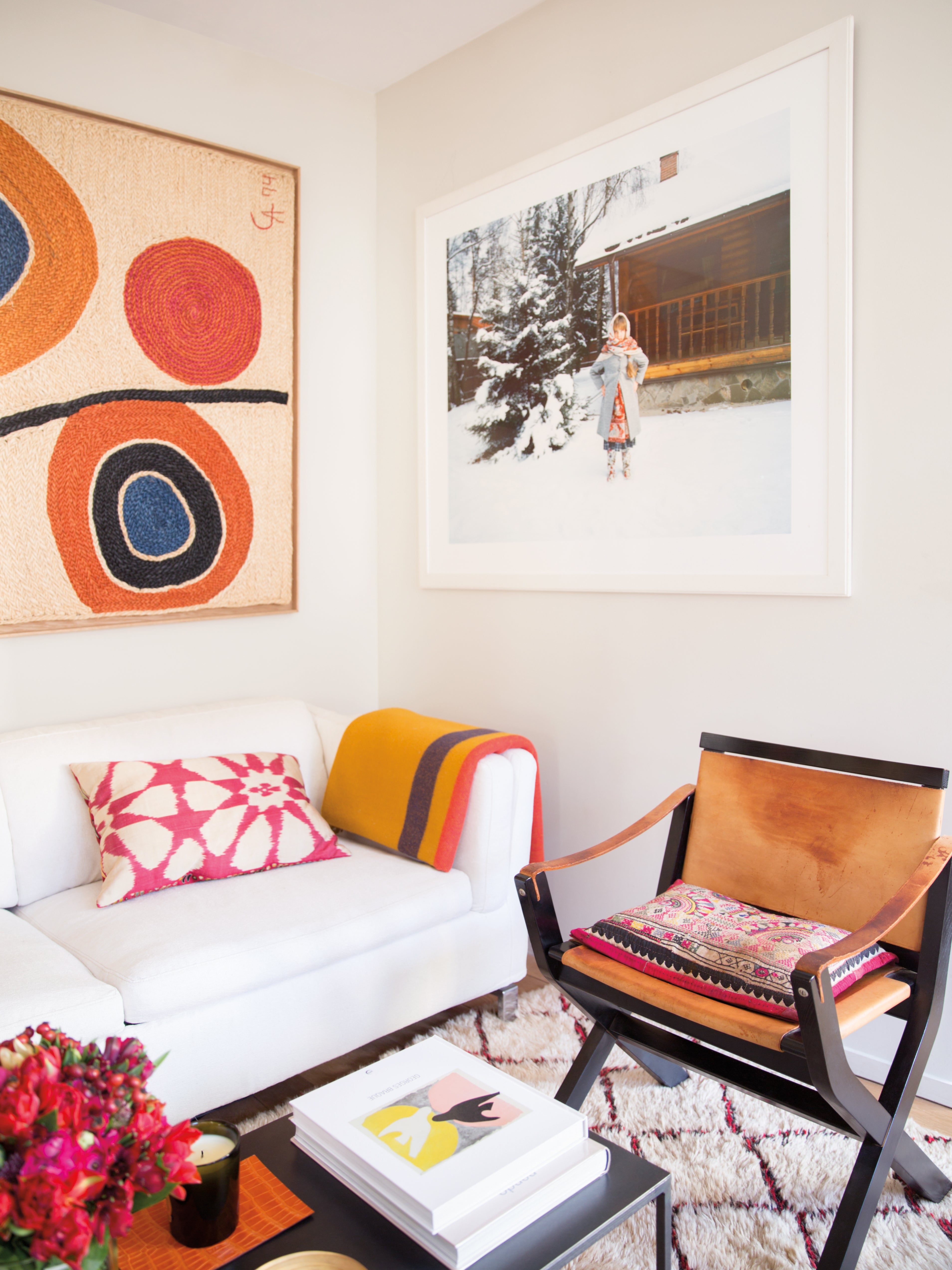 living room nook with pink and orange artwork