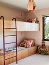 Bunk beds with burgundy railing