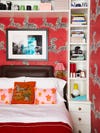 Small bedroom with red zebra wallpaper