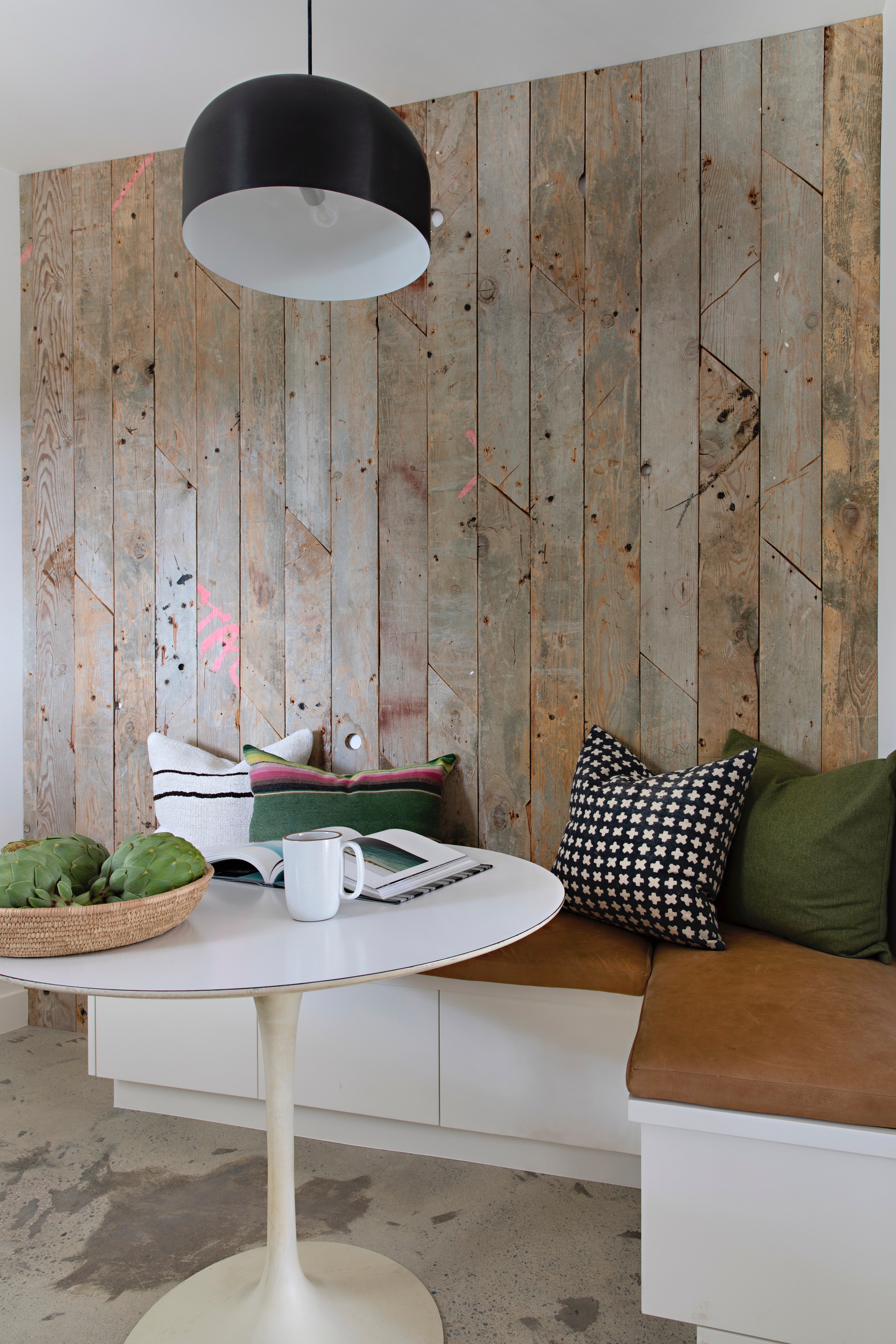 breakfast nook with salvaged wood plank wall