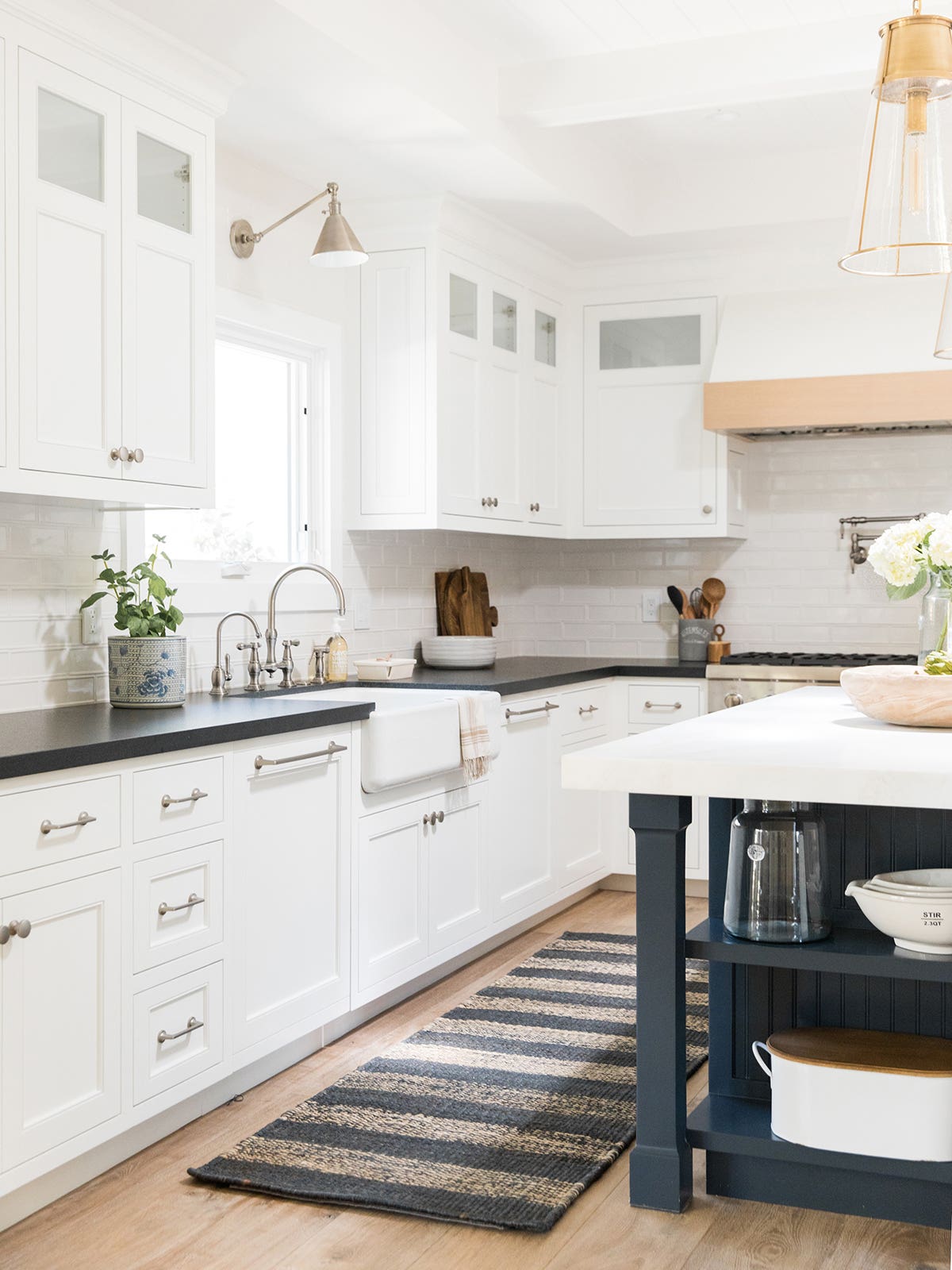 large white kitchen with black counters