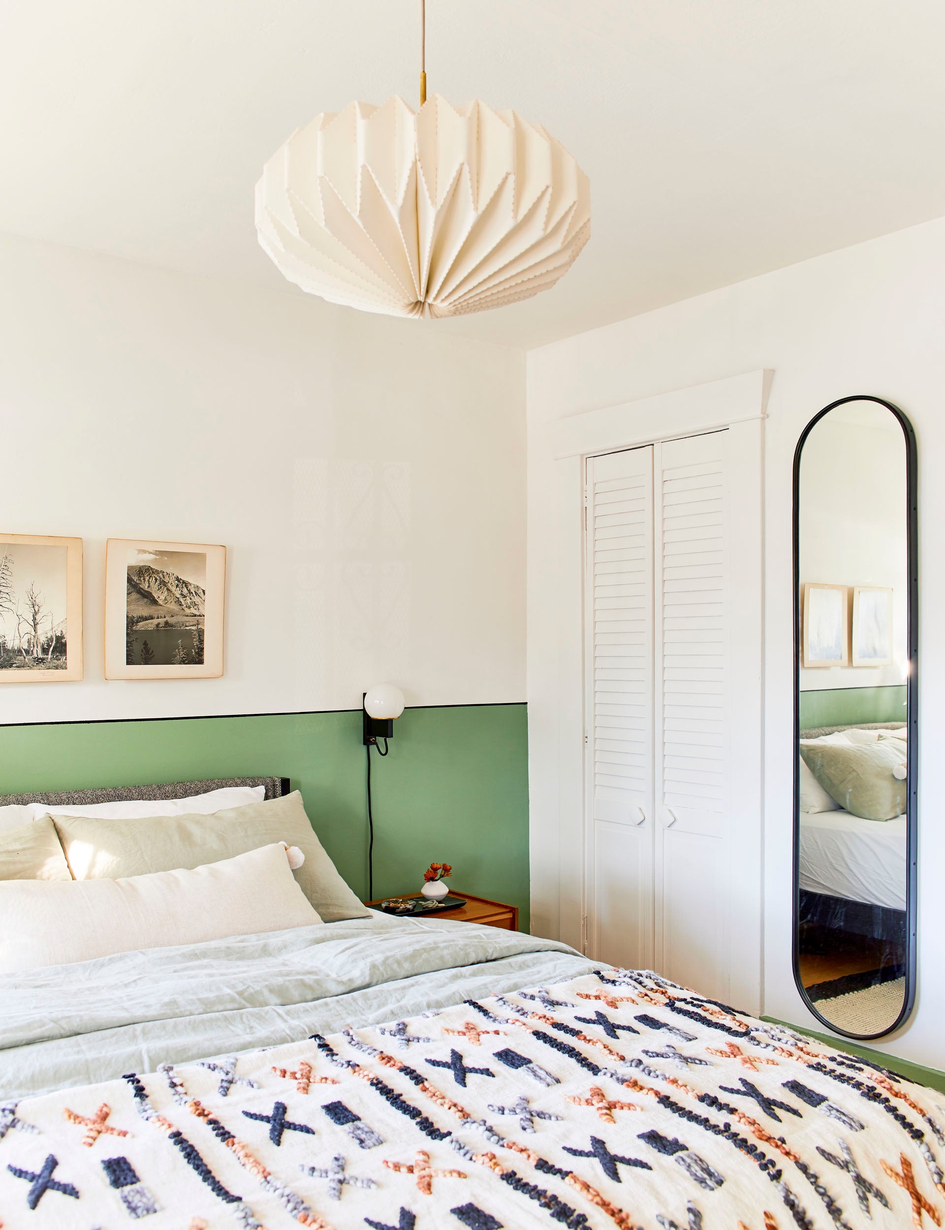 bedroom with green accent wall