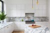 blue marble countertops and white cabinets