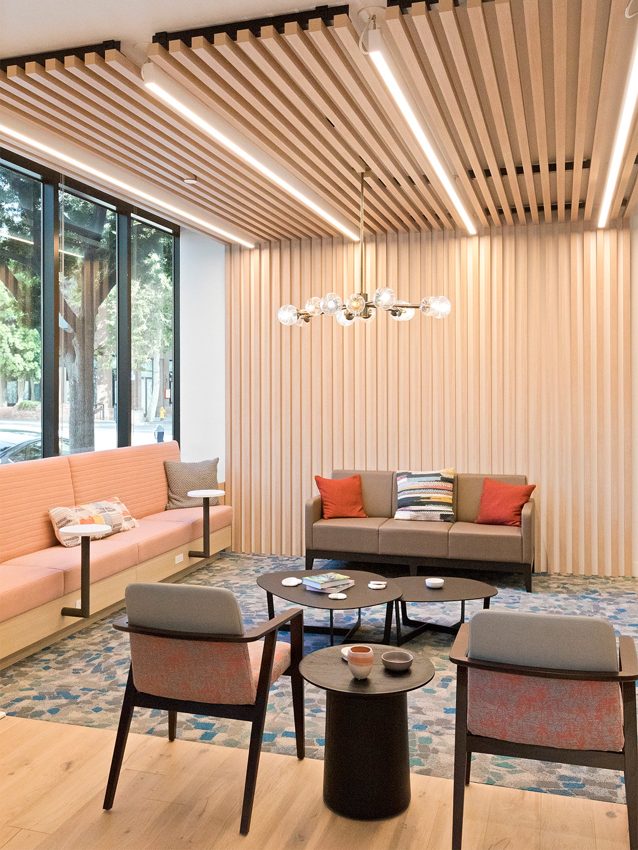 Waiting room with wood panels and colorful sofas